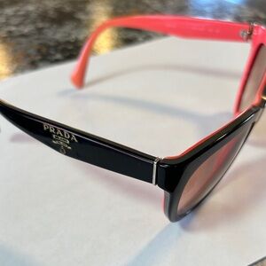 Prada Black Cat-Eye Sunglasses with Pink Lenses and Temples